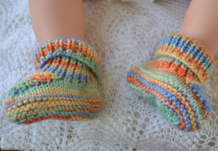 multi coloured rainbow bootees timmy